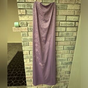 strapless purple dress. there was no brand. feels very light. lace up back.